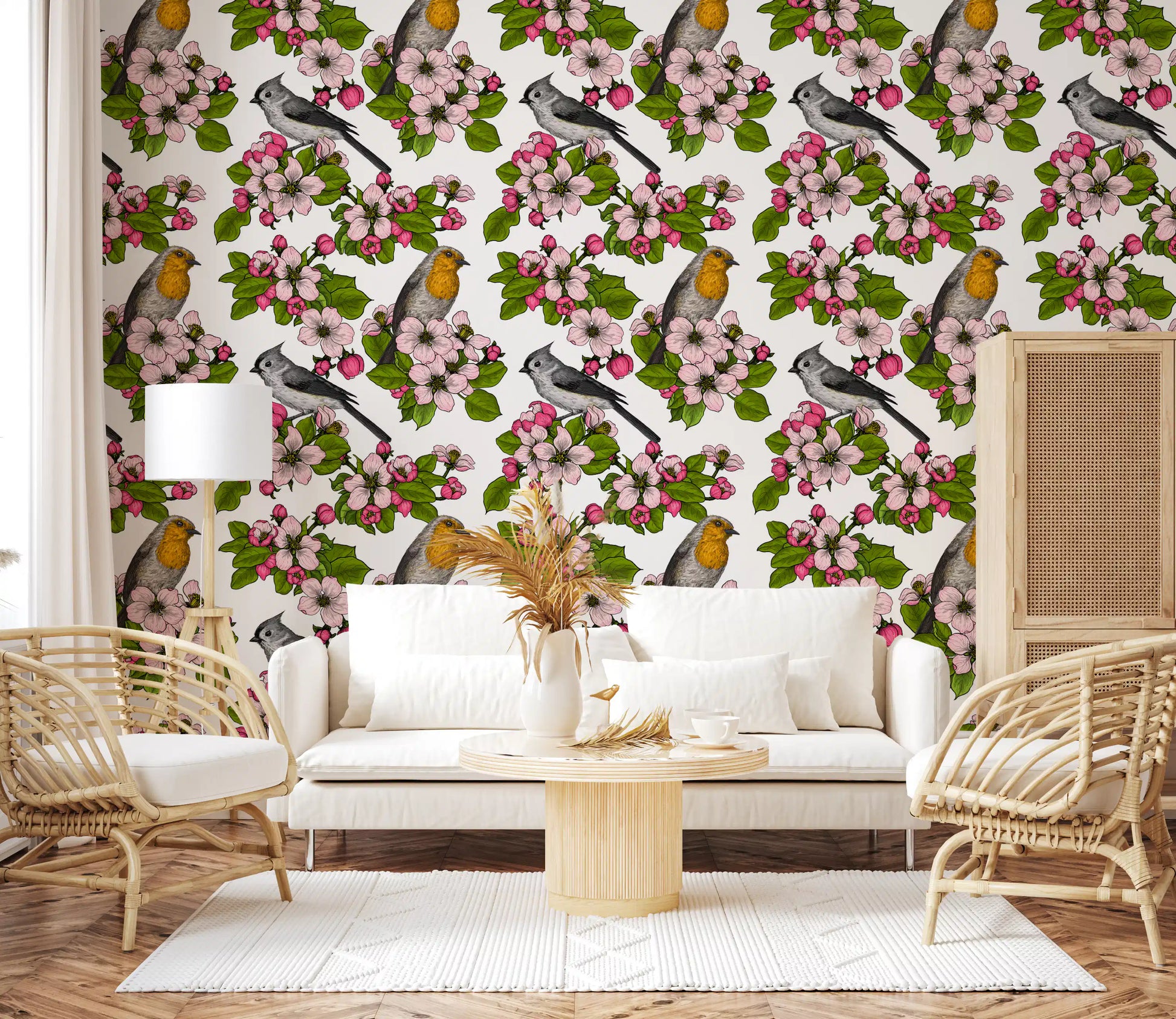 Birds and blossoms repeat pattern wallpaper with pink flowers on white.