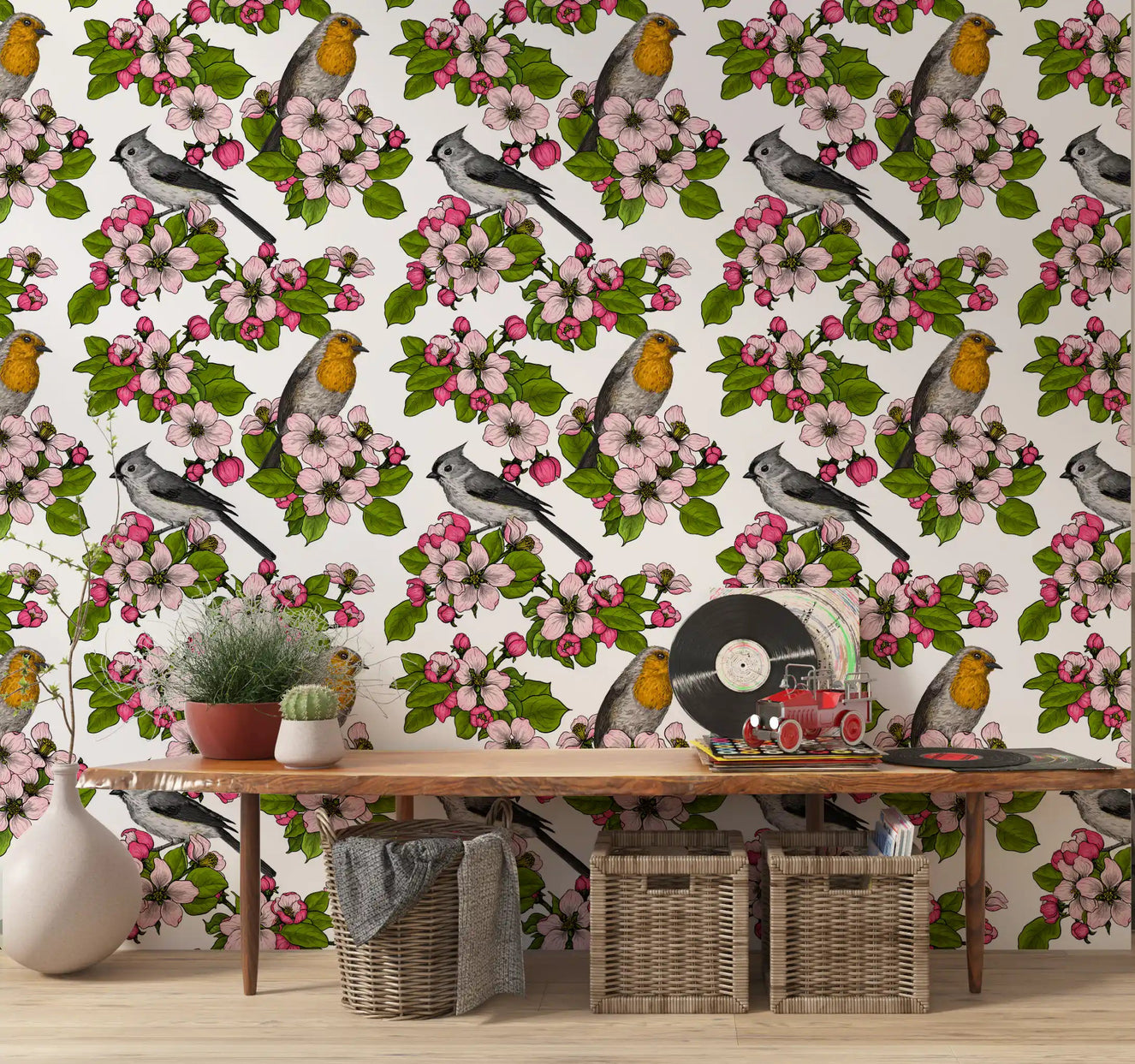Hallway wall covered in pink flower and illustrated bird wallpaper.