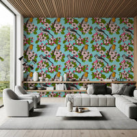 Pink cherry blossom buds and open blooms with green leaves on birds and blossoms wallpaper. 