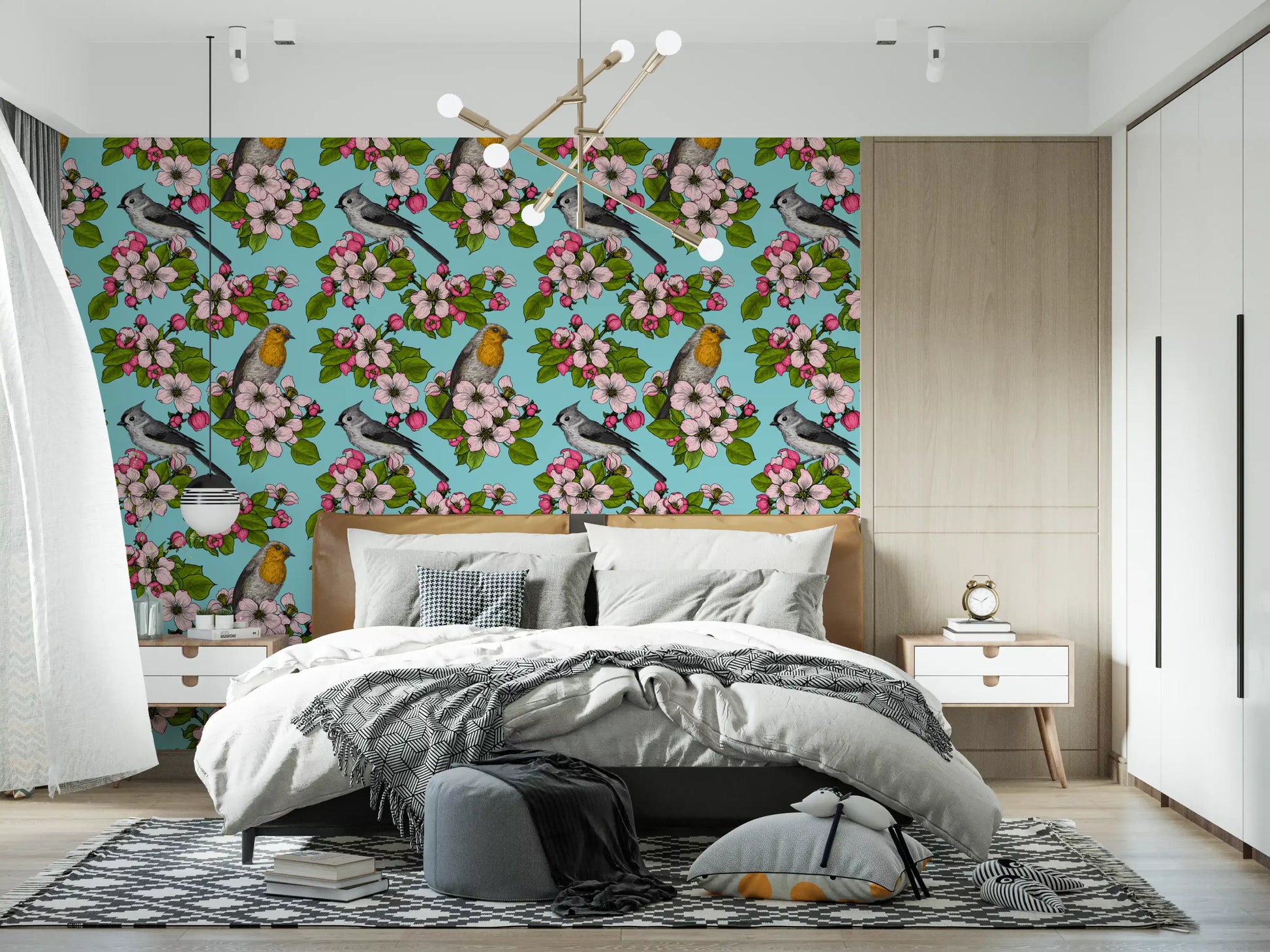 Bedroom wall with birds and blossoms repeat pattern wallpaper in powder blue.