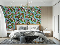Bedroom wall with birds and blossoms repeat pattern wallpaper in powder blue.