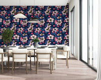 Pink apple blossom wallpaper on dining room wall backdrop.