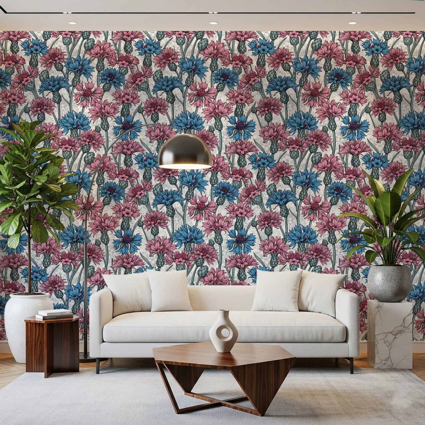 Blue cornflowers and pink petals on white background floral wallpaper.