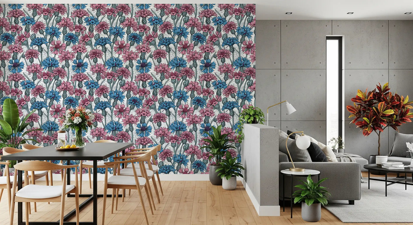 Detailed blue cornflowers and pink blossom garden print wallpaper.