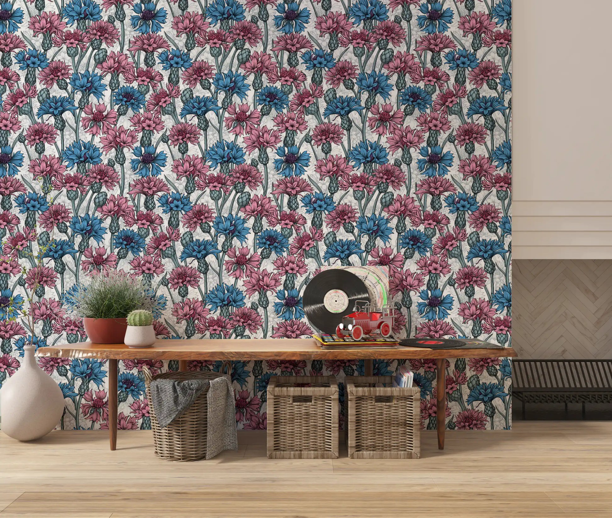 Blue cornflowers and pink petals on white background floral wallpaper.