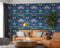 Symmetrical botanical wallpaper with cream butterfly and navy background.