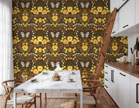 Brown and yellow garden illustration wallpaper with symmetrical floral motifs.