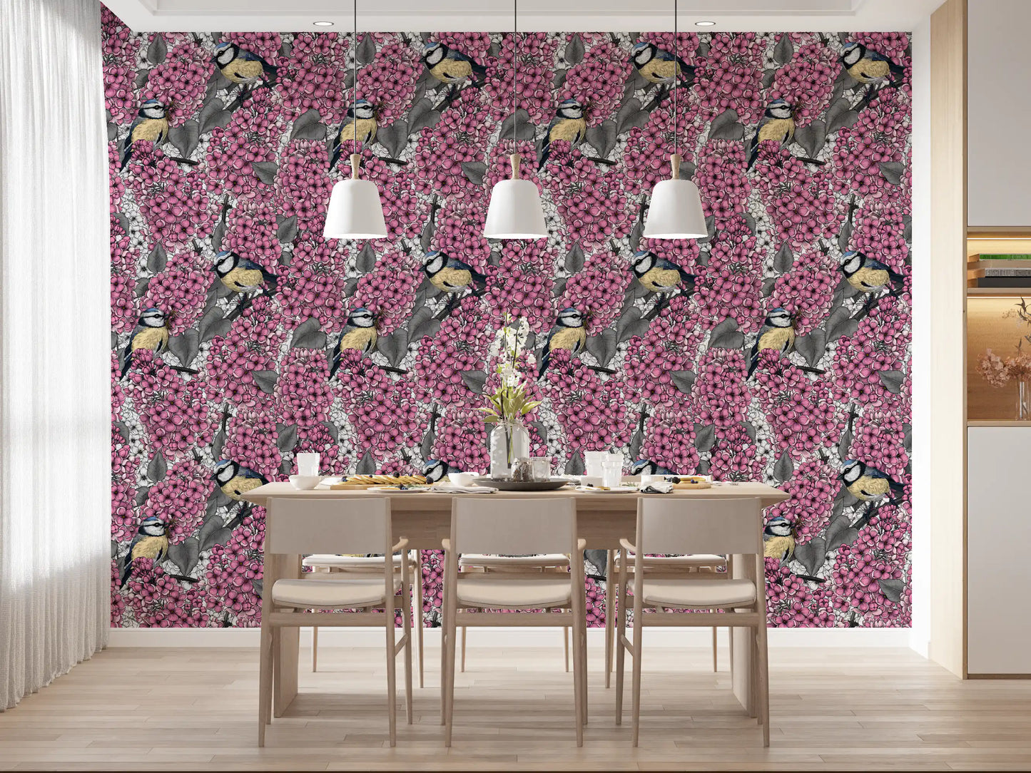 Birds wallpaper in a dining room featuring pink blooms and grey foliage.