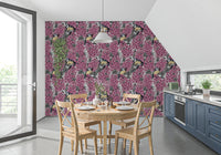 Wallpaper showing yellow and blue birds perched on pink lilac branches.