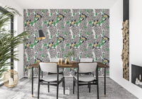 Etched style birds on a flowering tree branch wallpaper with green leaves.