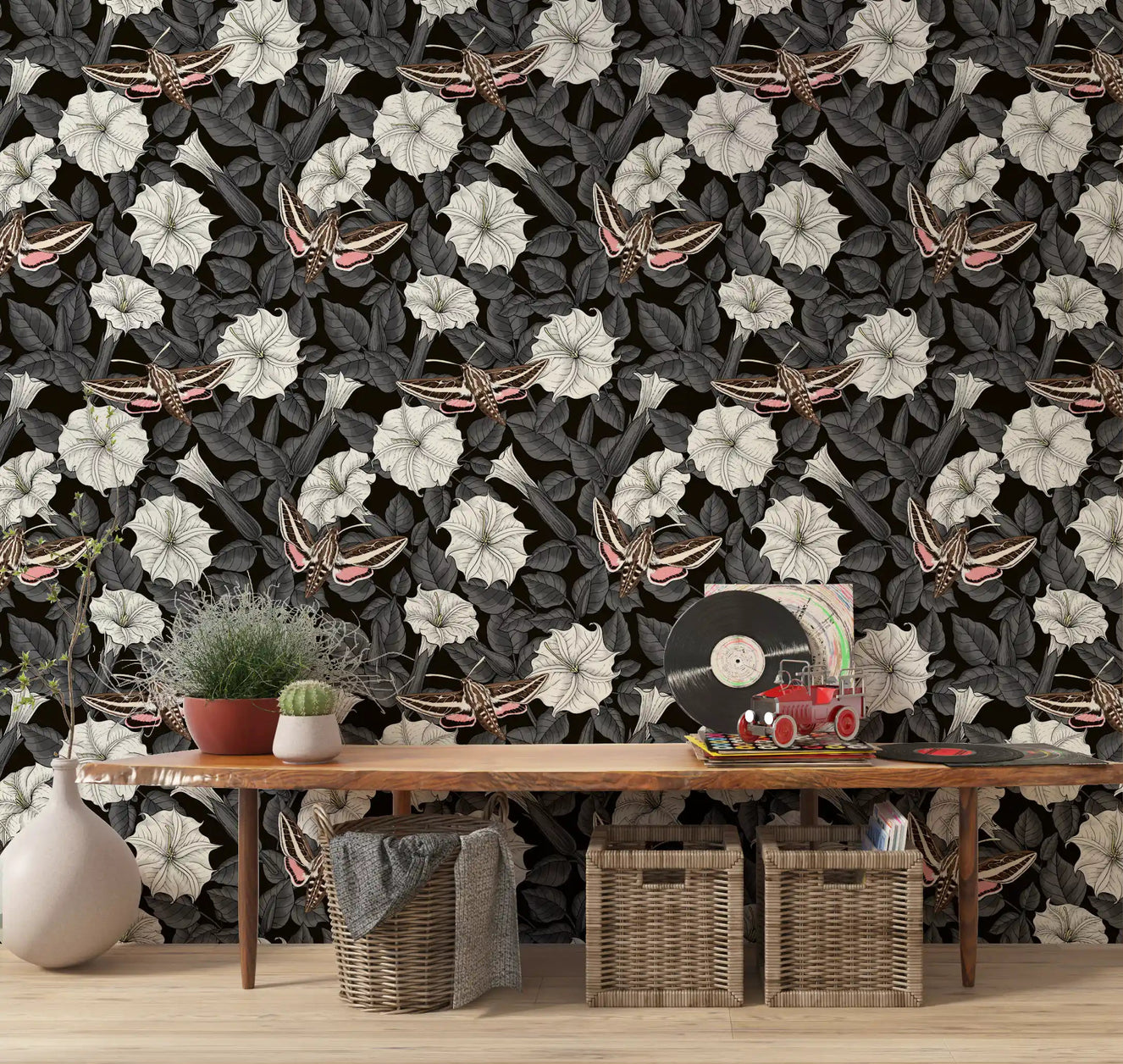 Large sphinx moths with pink wings on dark floral wallpaper for hallway.
