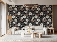 Detailed sphinx moths with striped wings on a dark floral wallpaper.