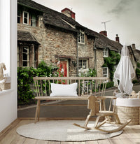 Timeless English Cottages Wall Mural shows grey stone walls and a red door.