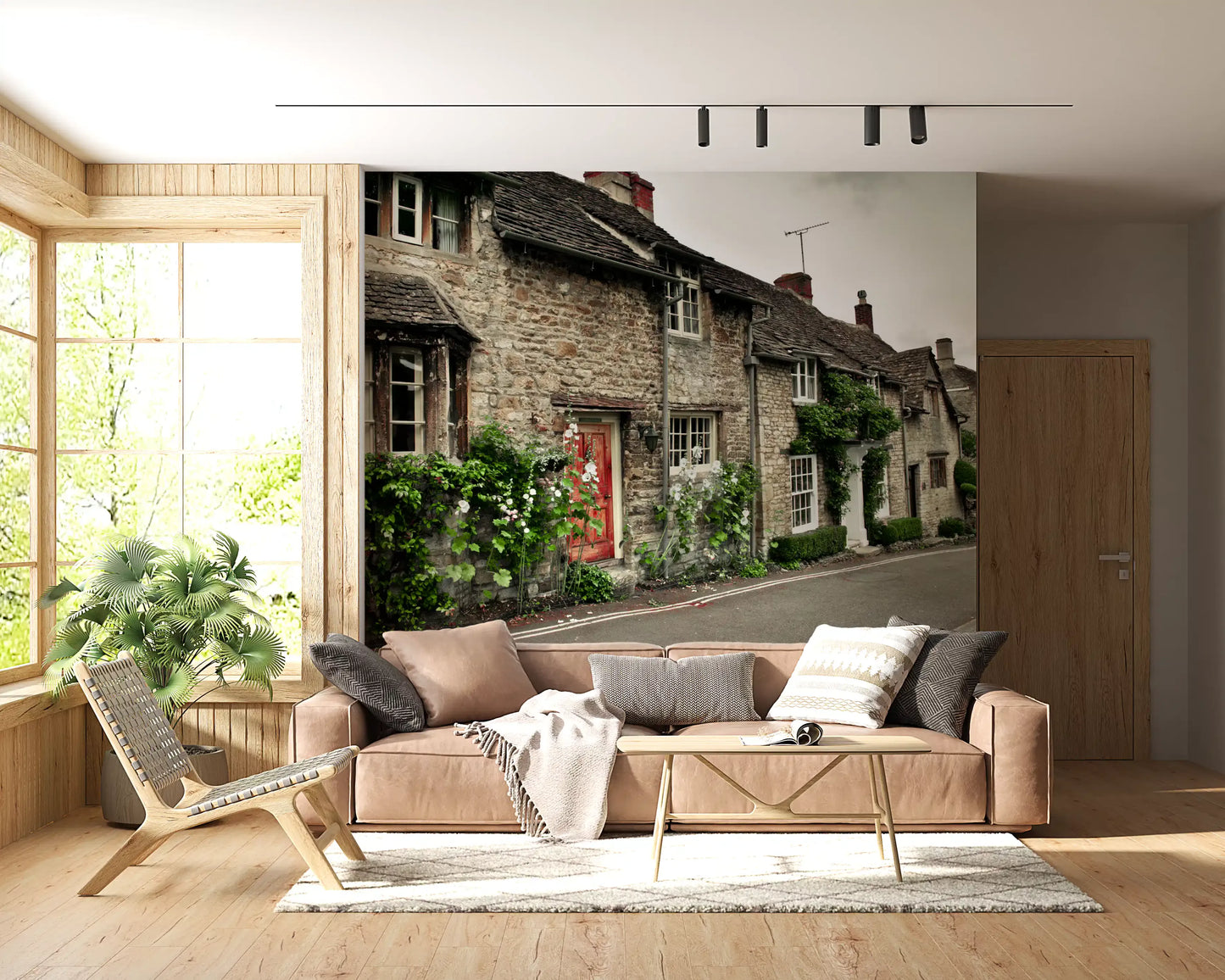 Living room wall mural featuring a historic village street and stone house.