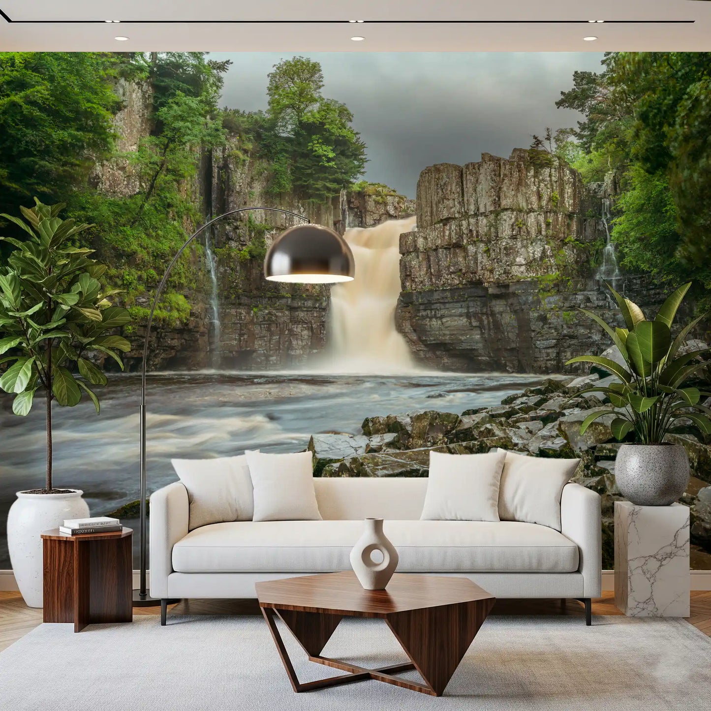 Nature wall mural with rocky waterfall and dark green foliage for a living room.