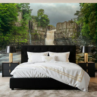 Forest falls wall mural showcasing a large waterfall and grey rock formations in bedroom.