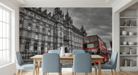 Grey stone historic building with red bus wall mural for dining space., GD9845