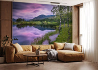 Dusk landscape wall mural featuring green hills and still water pond.