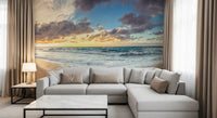 Golden Shoreline Serenity Wall Mural shows waves and pebble shore.