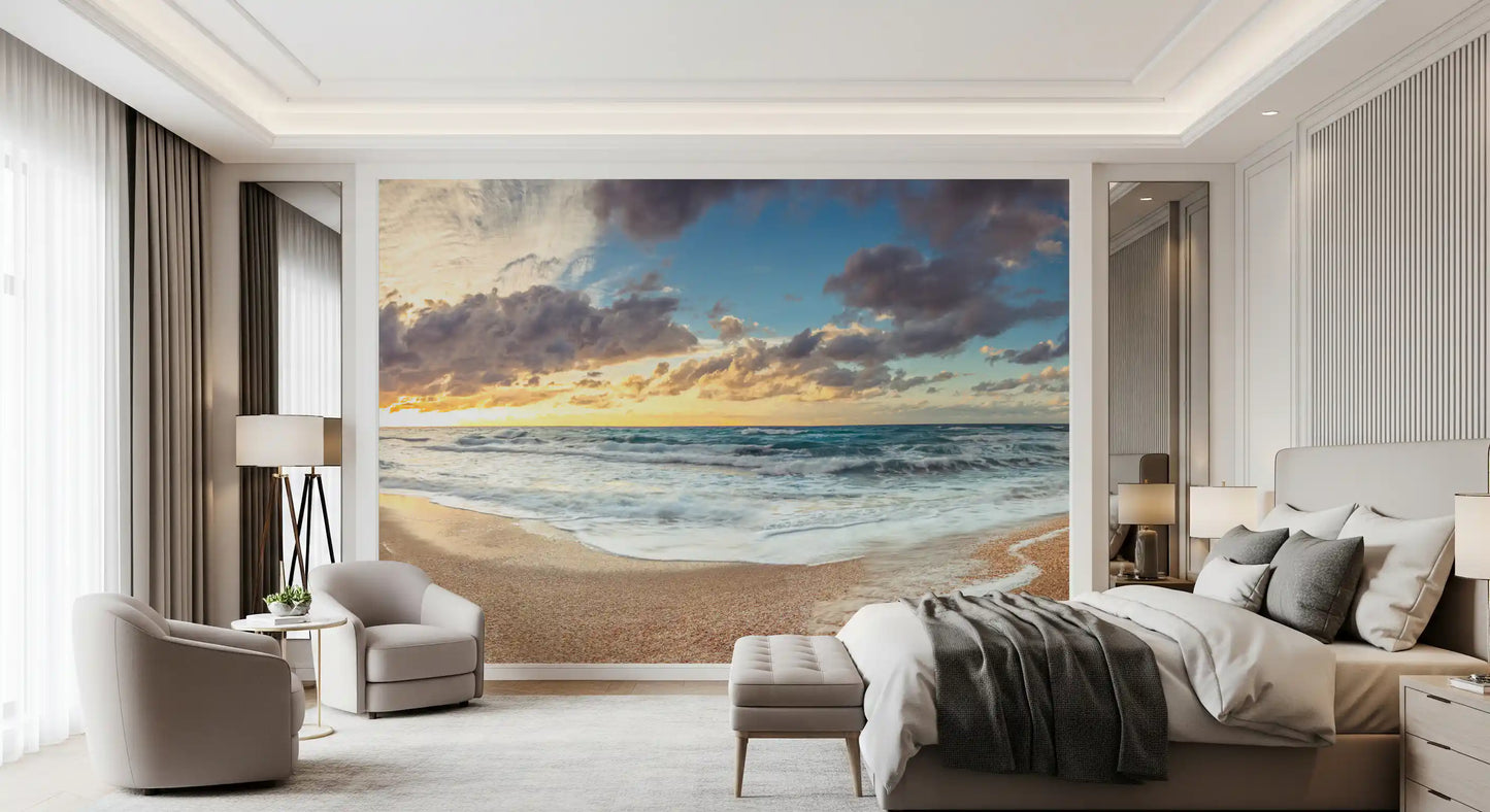 Shoreline wall mural with grey clouds and blue ocean water scene.