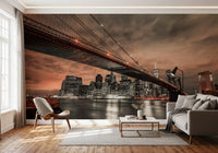 Iconic Bridge, Fiery Cityscape Wall Mural with glowing city lights for a sunlit living room.