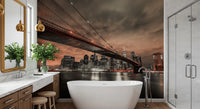 Brooklyn Bridge wall mural showing a night skyline and river reflections in an bathroom.
