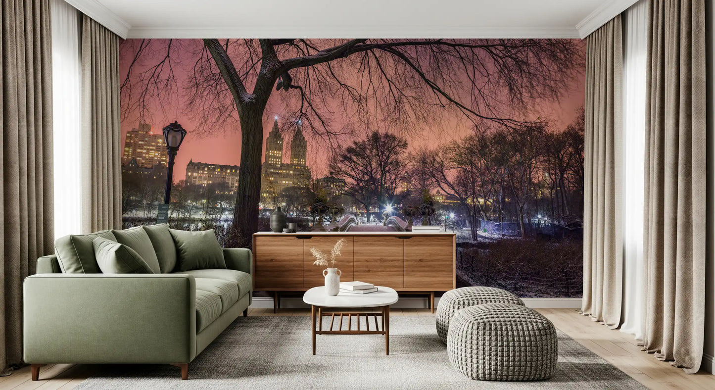 Bow Bridge covered in snow at night with city lights as a winter lounge wall mural.