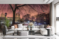 Bare winter tree branches framing a snowy bridge in a purple dusk wall mural.