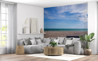 Wide beach landscape wall mural with blue sky and textured pebble ground detail., GD9870