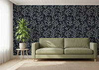 Dark background wallpaper showing textured botanical branch artwork.