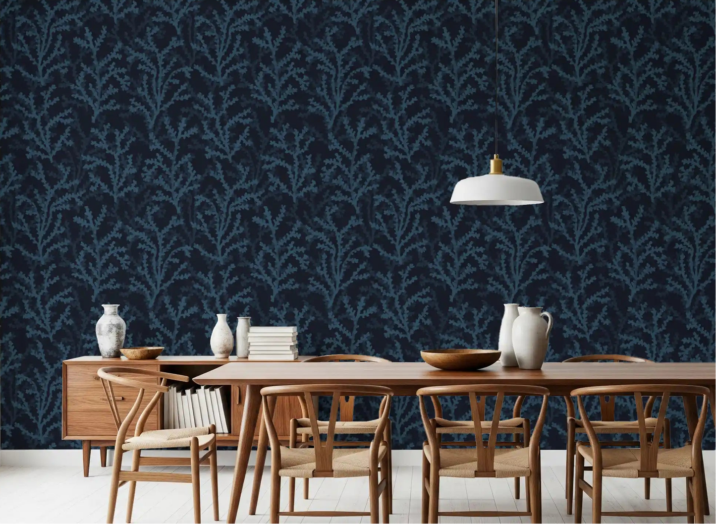 Painted branch motif wallpaper in deep blue colors for dining spaces.