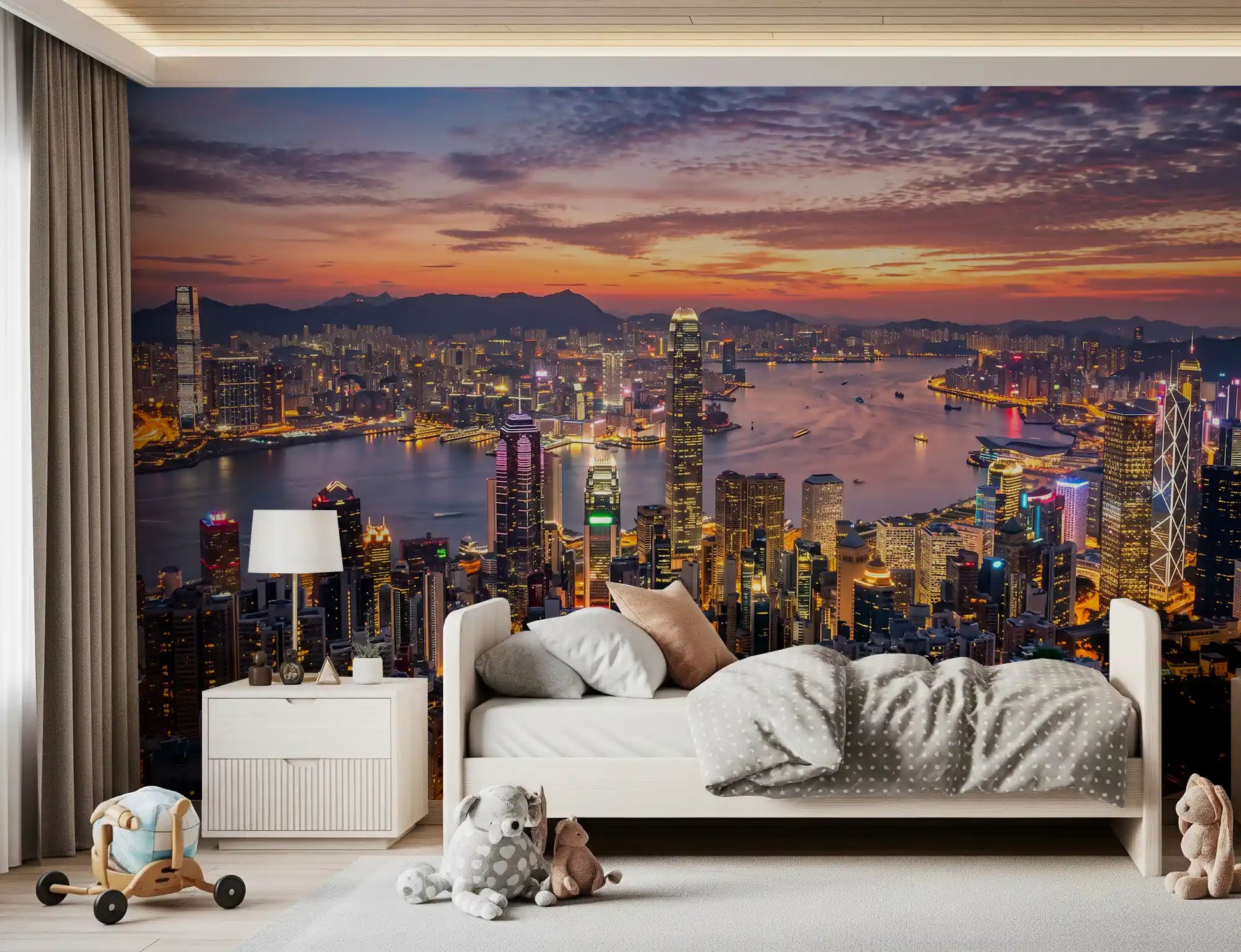Twilight sunset wall mural with glowing city lights and mountain background.