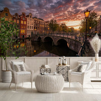 Evening hour skyline wall mural with an arched bridge for a reading area.