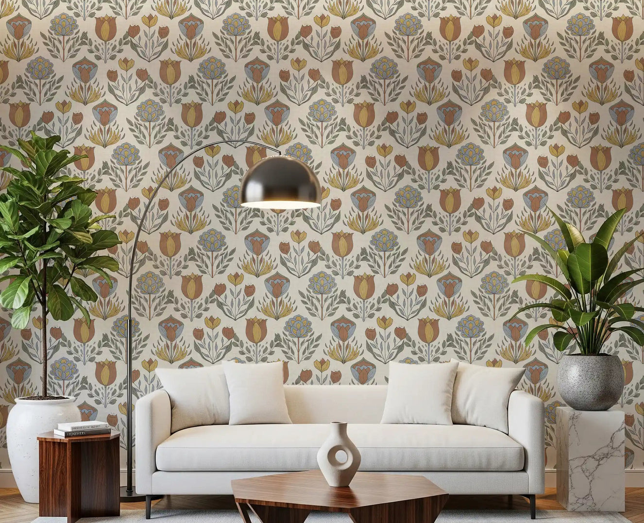 Living room feature wall in Nordic folk bloom wallpaper above sofa with and brass lamp.
