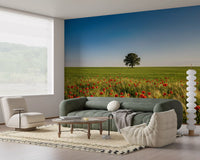 Red poppy and green grass mural backdrop behind a lounge sofa., GD9896