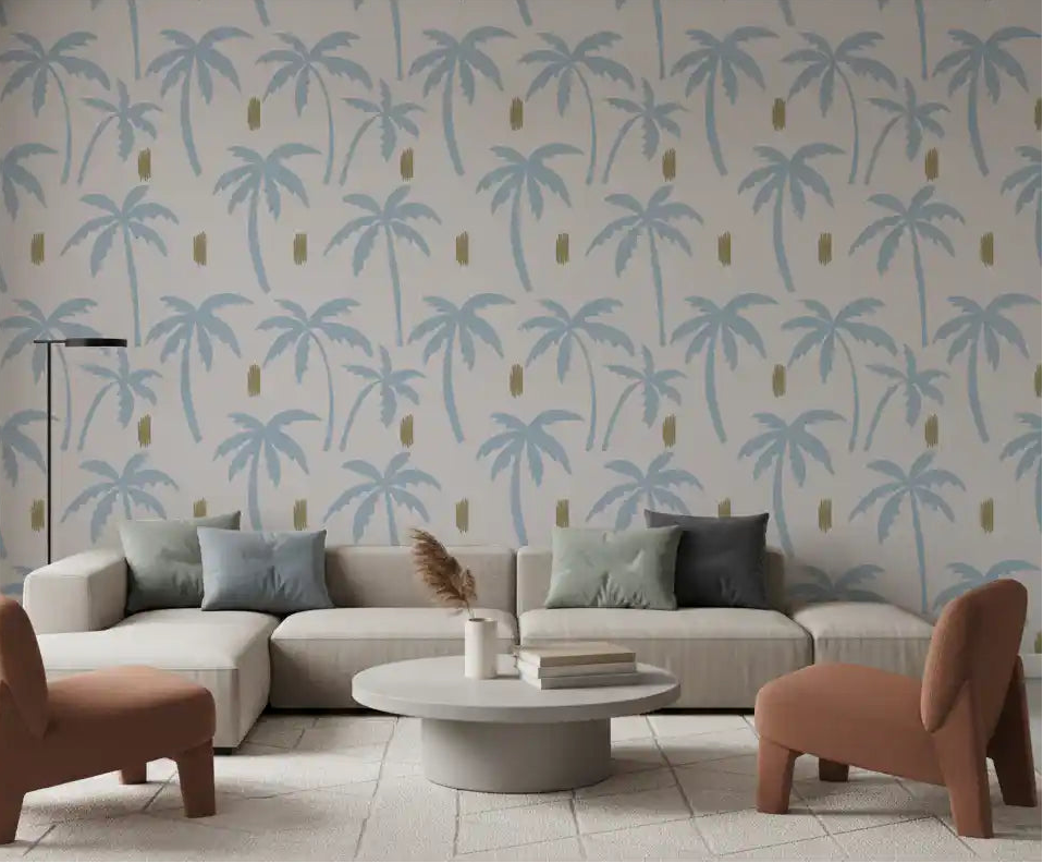 Pale blue palm tree wallpaper bringing breezy boho calm to a living room.