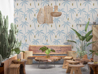 Sun-faded palm tree wallpaper softening the back of a small seating area., GD9900
