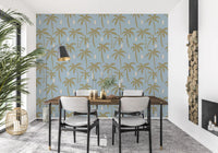 Tall gold palms scatter across a soft blue ground in this boho coastal wallpaper., GD9902
