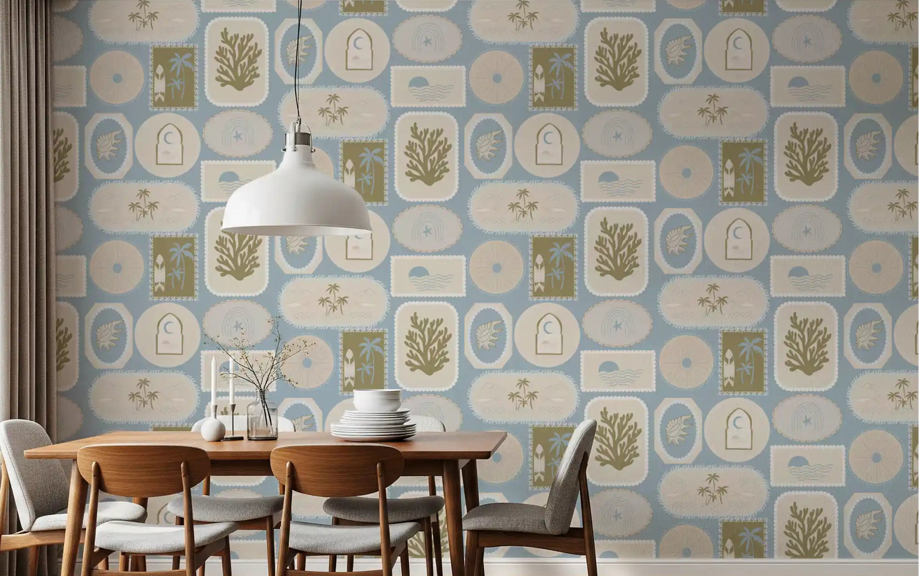 Sandy beige wallpaper with olive coastal motifs flow into a dining room.
