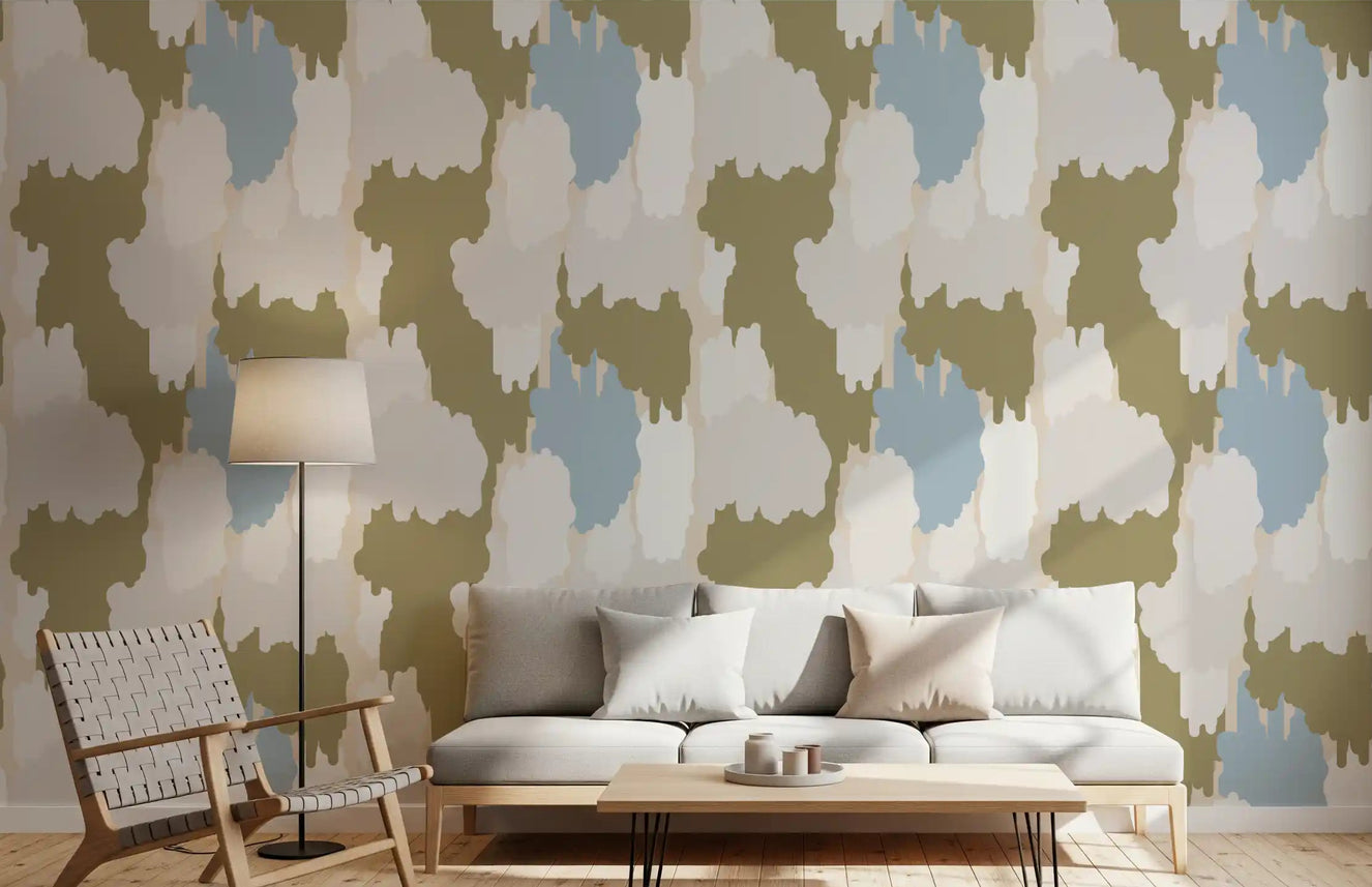 Living room walls hold a layered, painterly look with olive coastal wallpaper