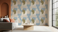 Layered cloud forms give the soft blue coastal wallpaper a relaxed rhythm.