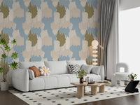 An olive shape anchors this abstract coastal wallpaper among paler cloud washes.
