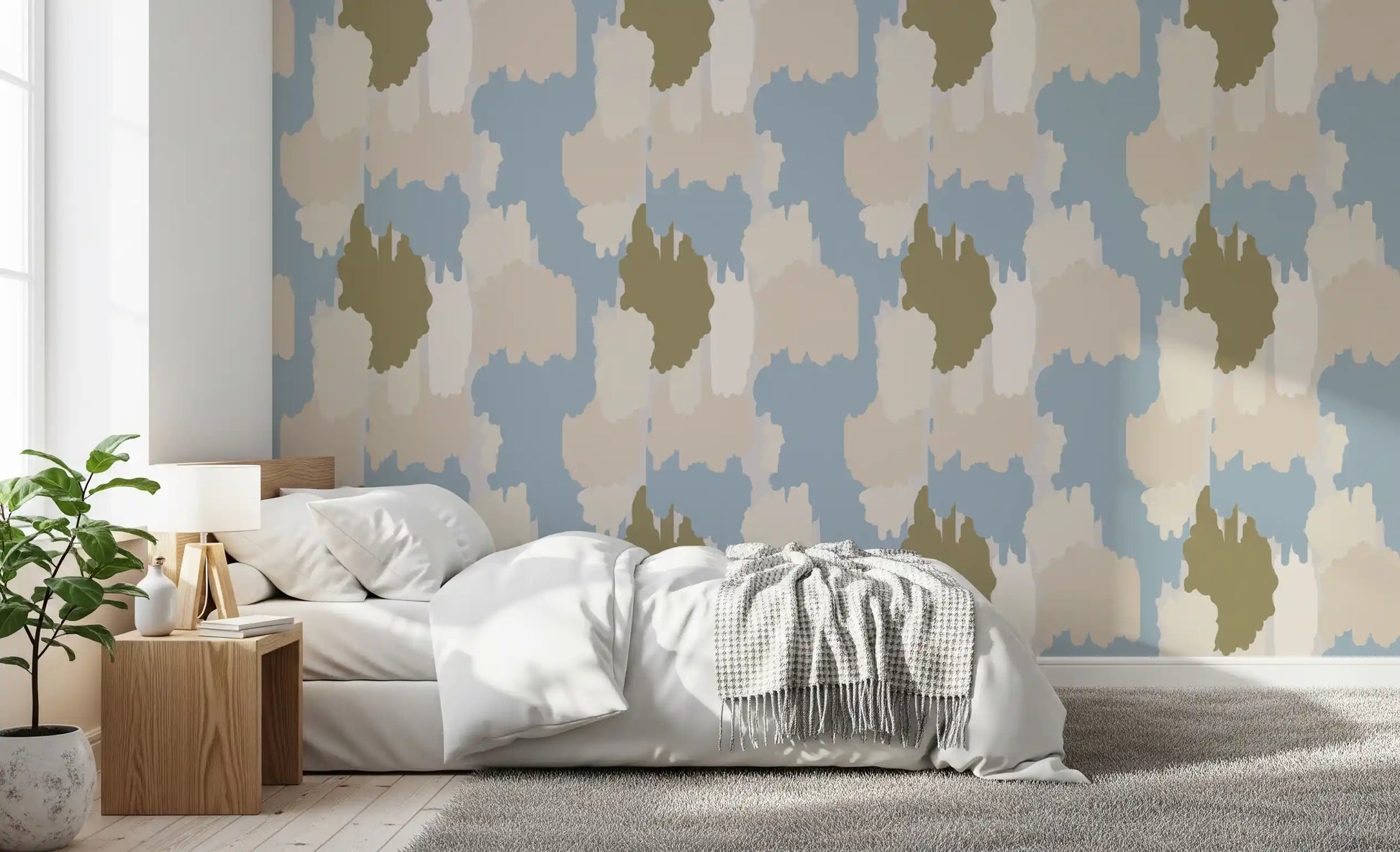 Olive, cream, and beige tones overlap softly in the boho coastal wallpaper.