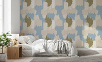 Olive, cream, and beige tones overlap softly in the boho coastal wallpaper.