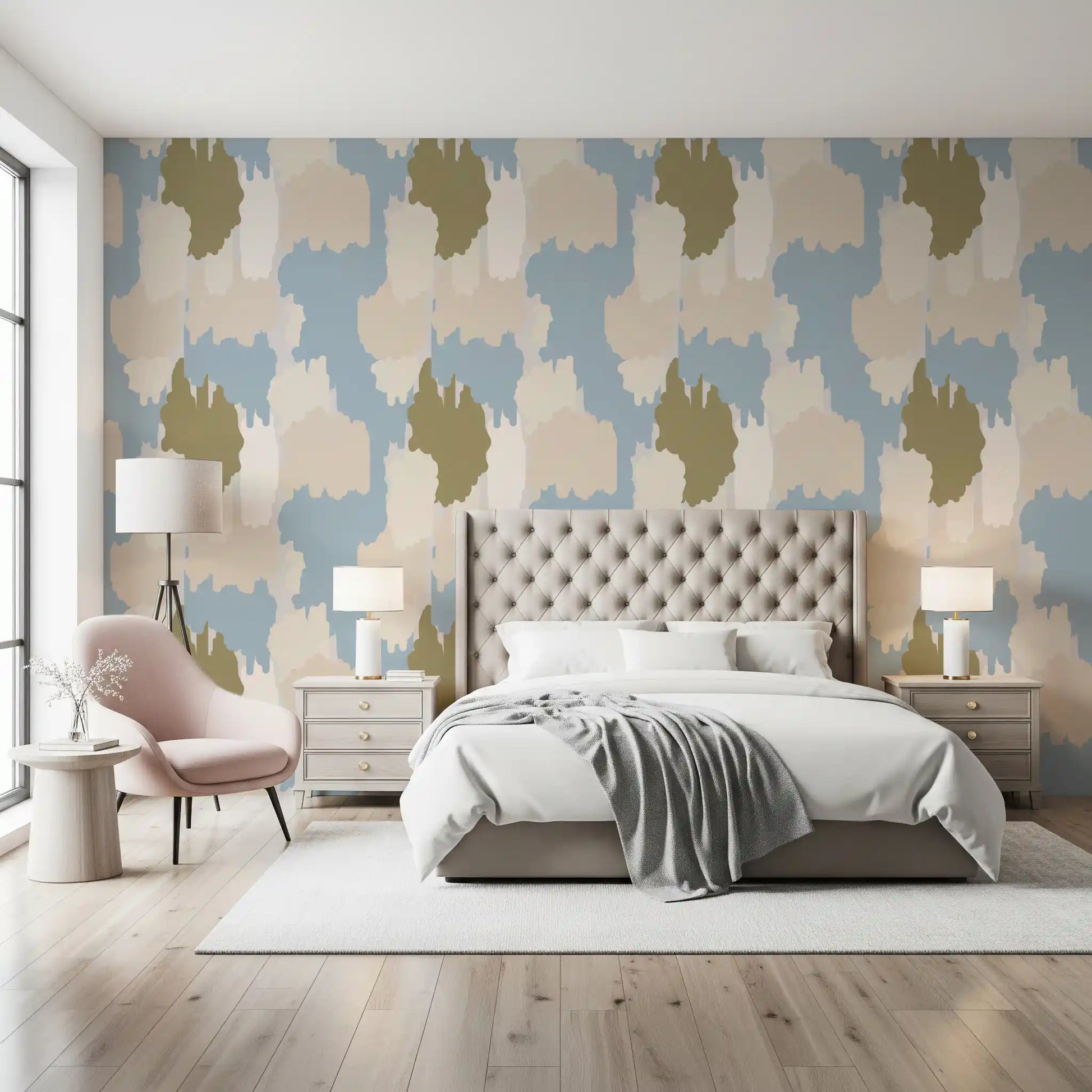 Quiet sage and blue cloud shapes drift through a bedroom in this boho coastal wallpaper.
