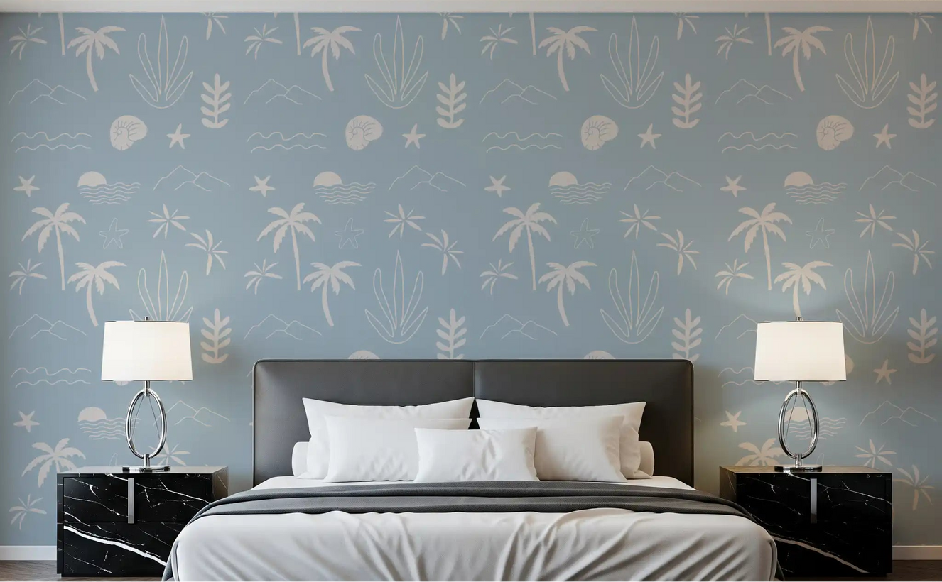 Calm seaside mood settles across a bedroom dressed in soft blue boho coastal wallpaper.