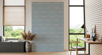 Study wall reads quiet and breezy with Soft Blue Boho Coastal wave wallpaper.