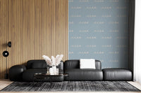 Cream-white waves layered over a dusty blue base in this boho coastal wallpaper.
