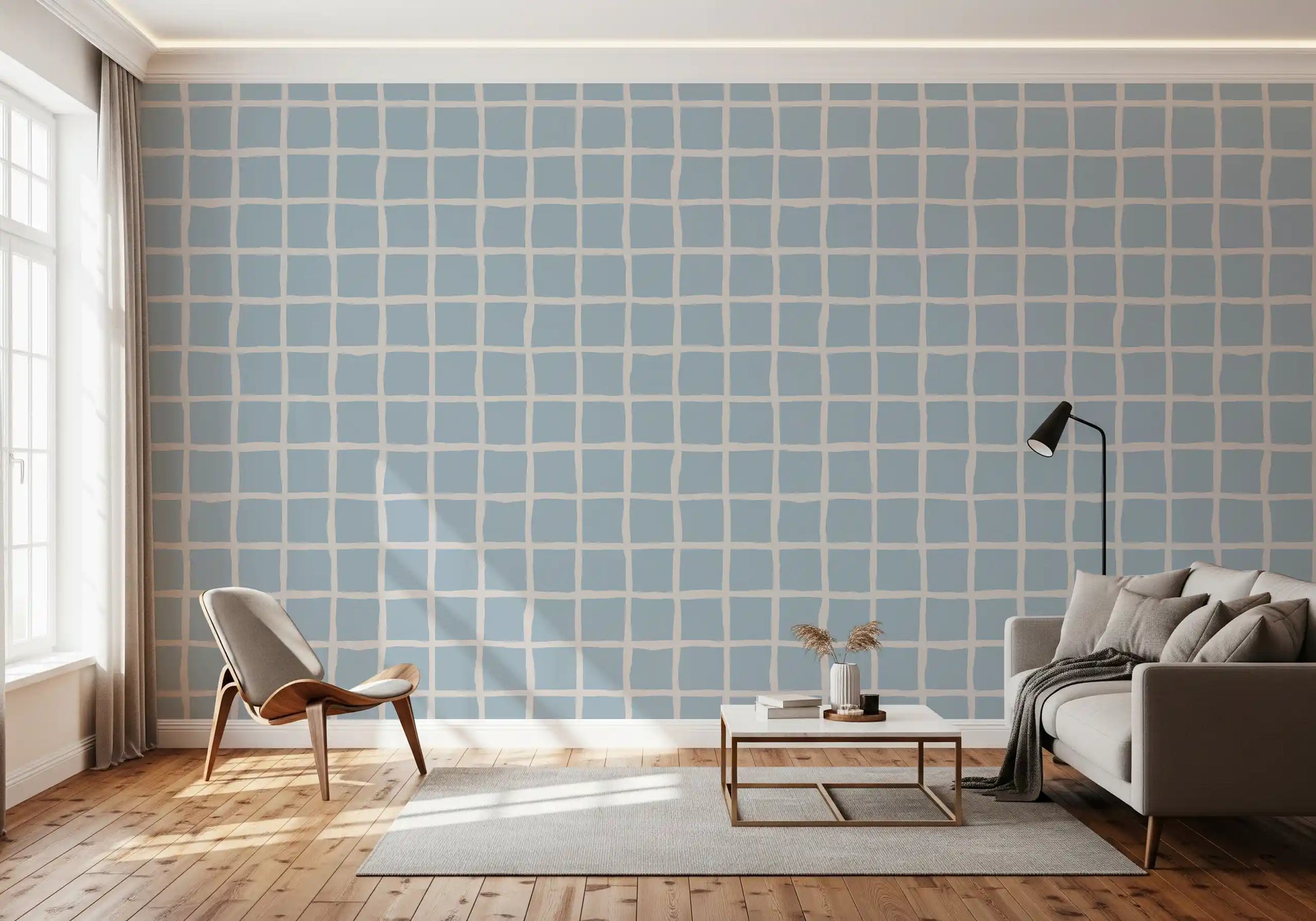 Boho Coastal Grid wallpaper as feature wall behind a gray sofa in airy contemporary living room., GD9913