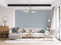 Soft blue grid wallpaper in living room with cream curtains and natural light through tall windows., GD9913